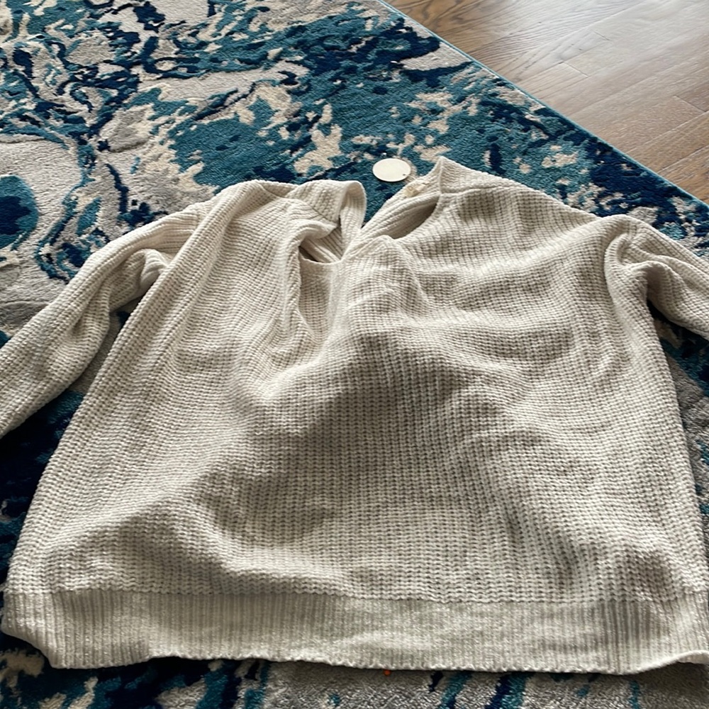 Cream sweater with back twist detail